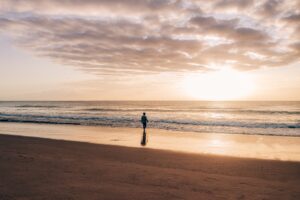 A person walking on a beach