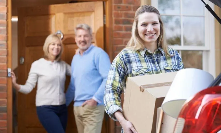 family with child packing boxes