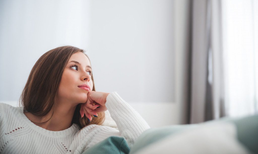 woman looking at window